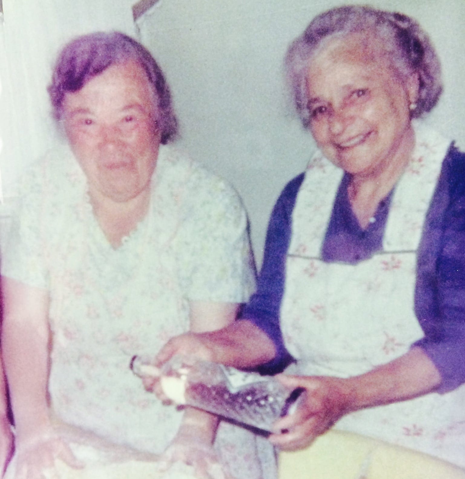 My great grandmother baking with her friend