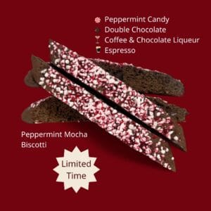 Close- up of Bellanini's Baby It's Cold Outside Biscotti topped with crushed peppermint candy and studded with chocolate chips on the side.